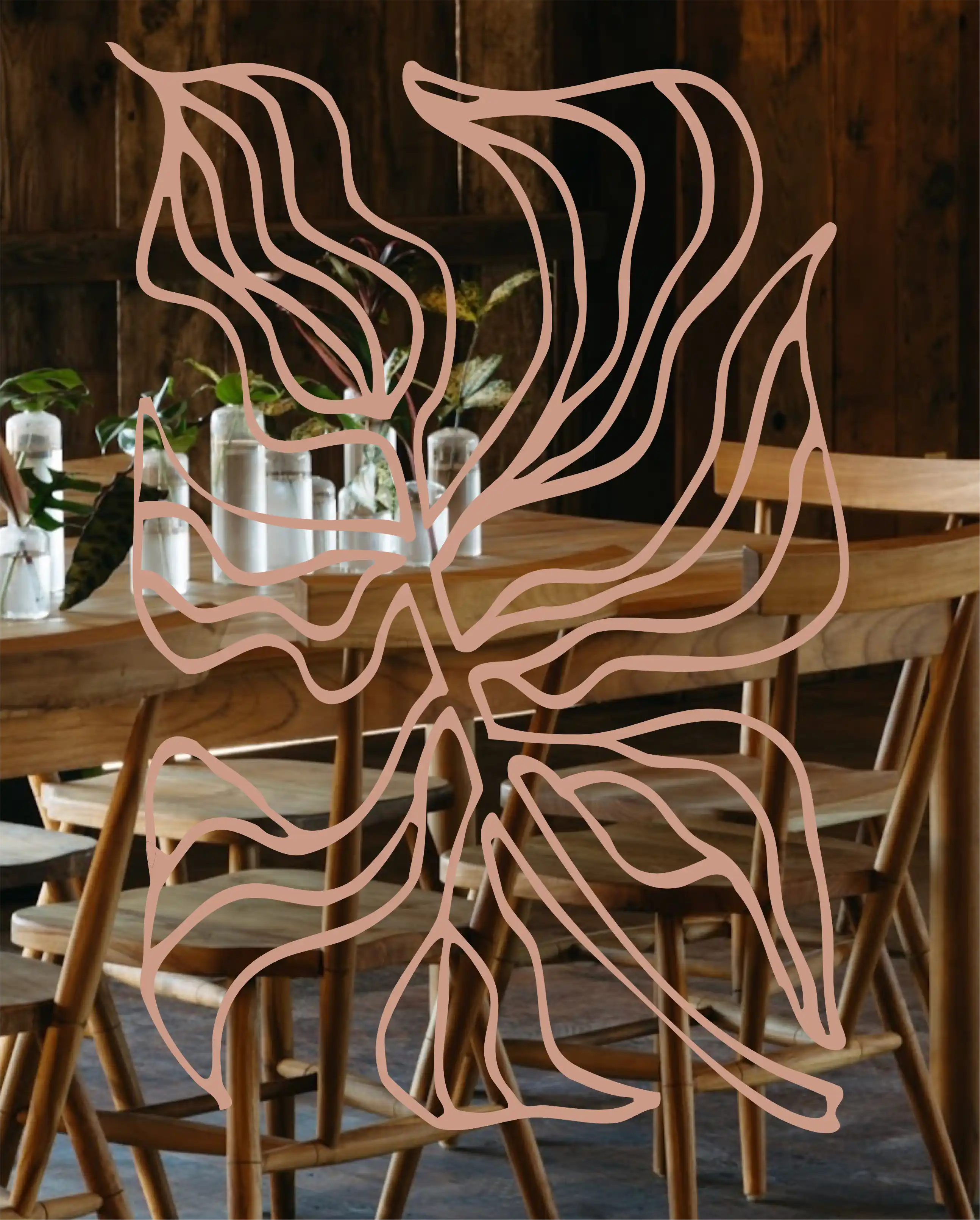 Wood tables styled with small plant arrangements in a warm interior.